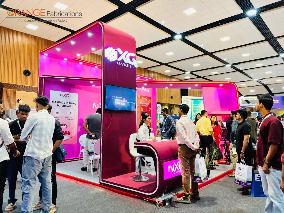 xg markets fintech illuminated exhibition booth in kochi curved neon magenta fintech exhibition stand with raised platform illuminated fascia and reception counter in kochi